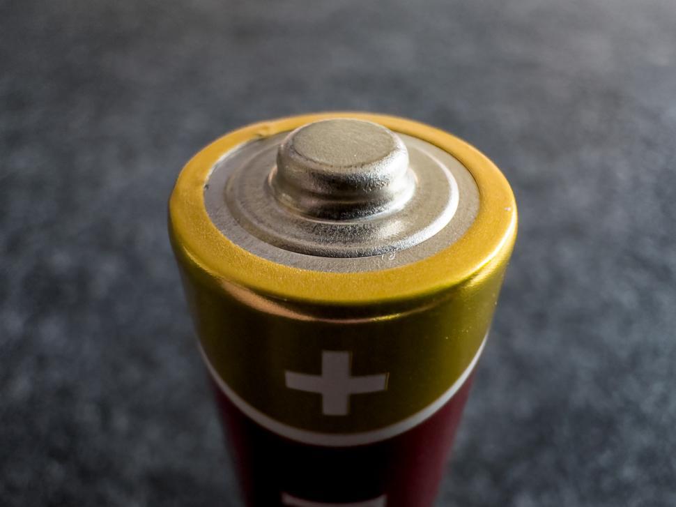 Free Image of Close-up view of a battery showing its top contact and design details 