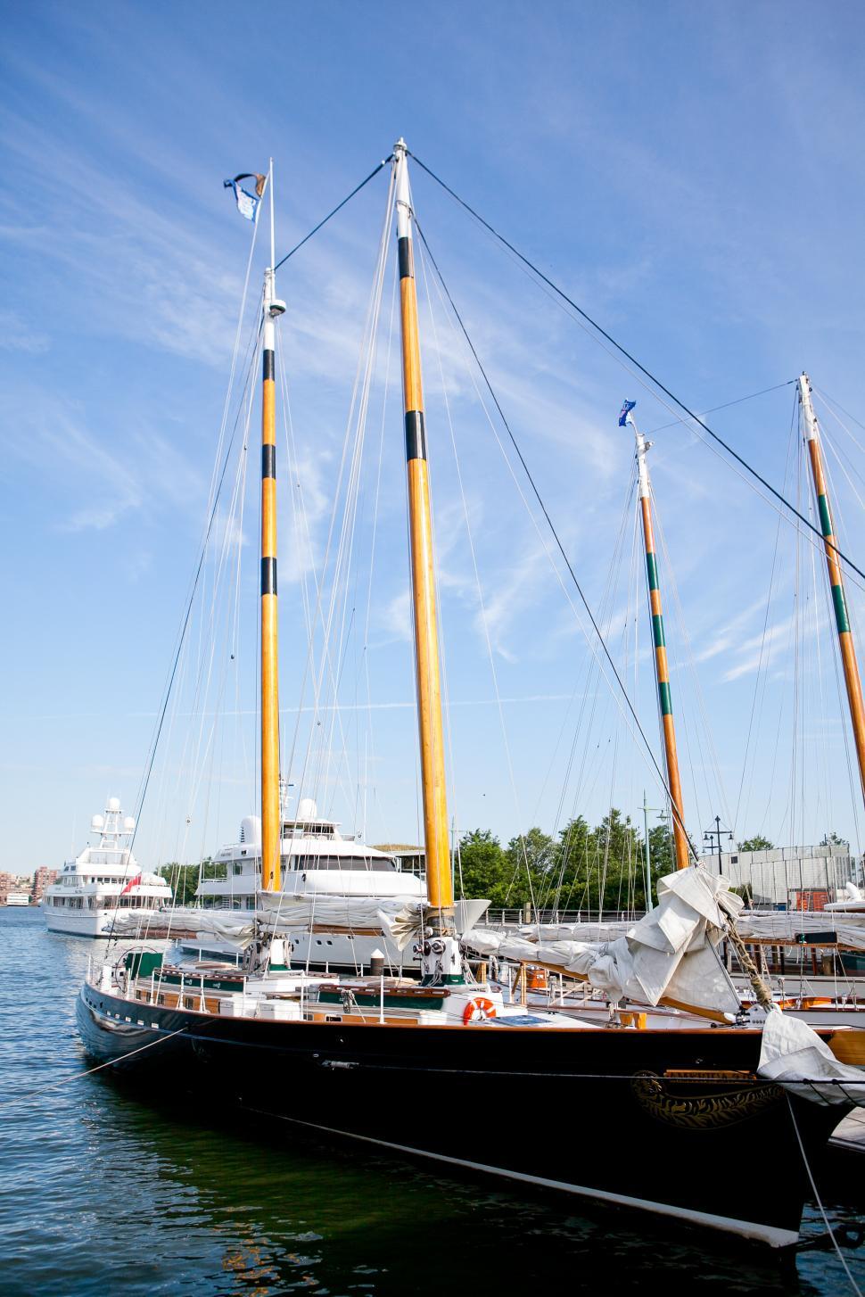 Free Image of Sailing vessel docked at the harbor on a sunny day 
