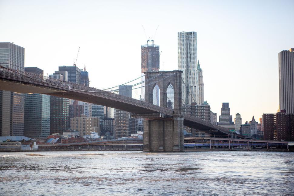 Free Image of Brooklyn Bridge at dusk with city skyline in background 