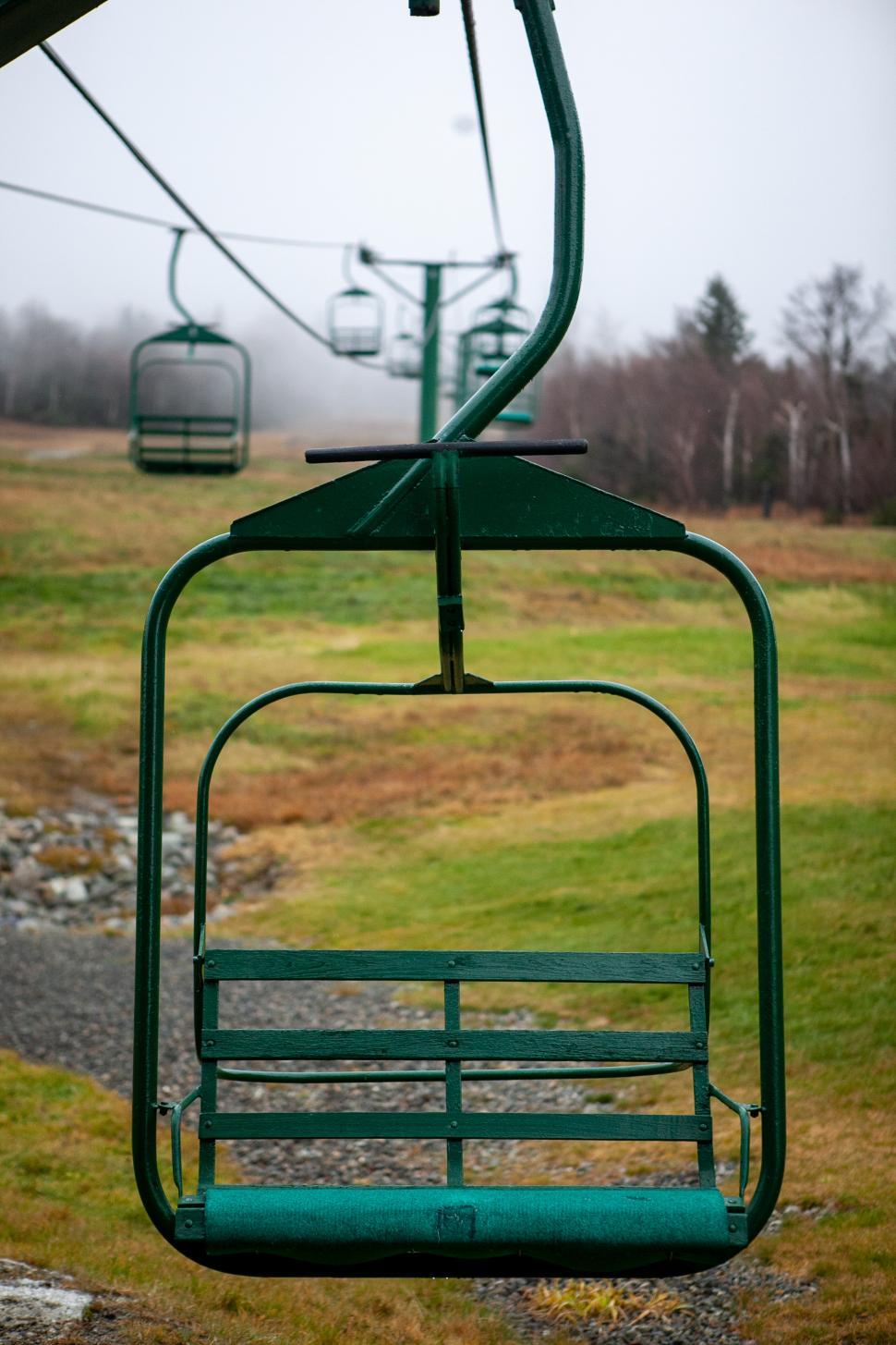 Free Image of Empty ski lift awaiting riders on a misty mountain morning 