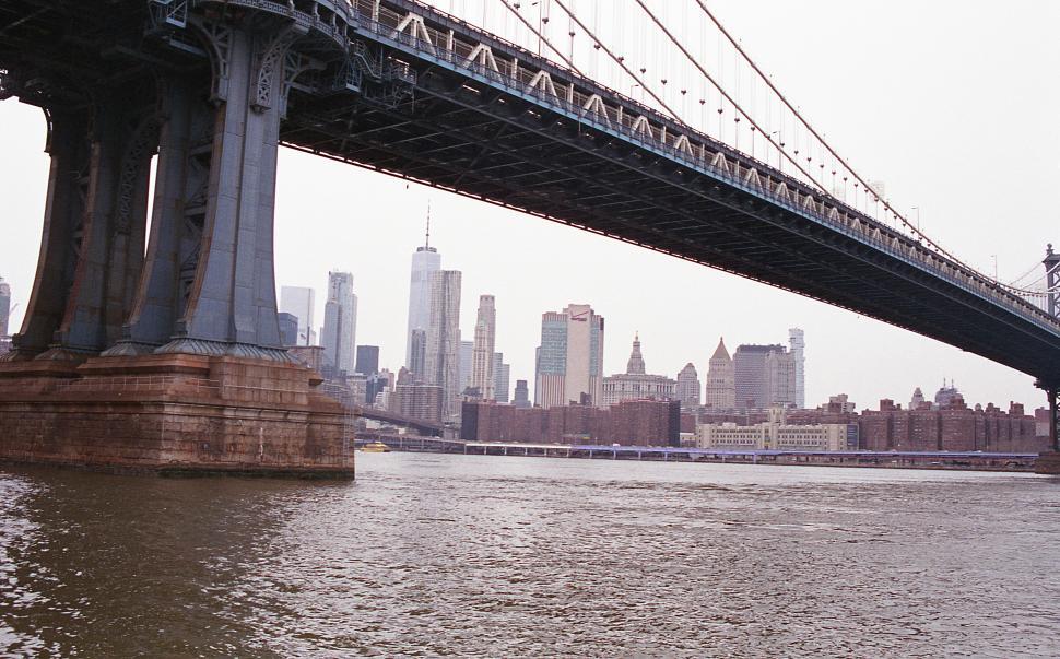 Free Image of Manhattan Bridge spans over the East River with New York City skyline view 