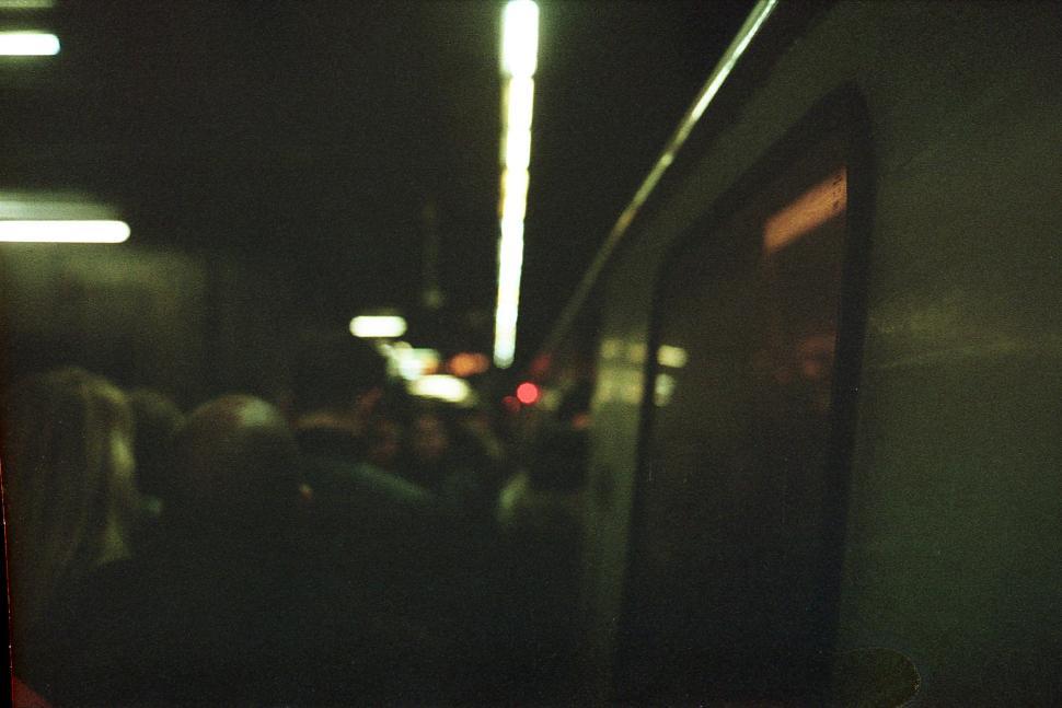 Free Image of Crowd gathers at underground train platform during evening commute 
