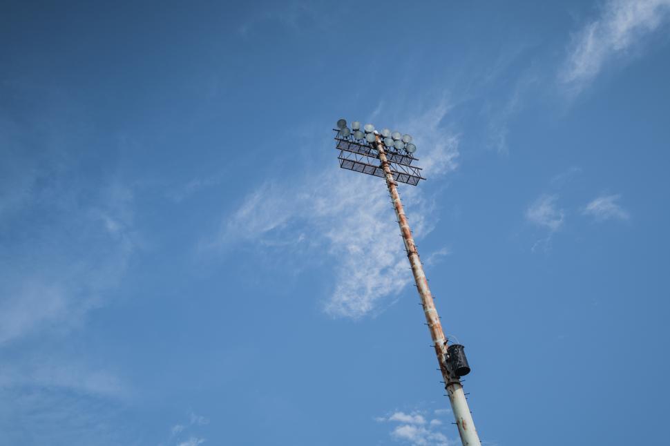 Free Image of Bright stadium lights illuminate the sky in an empty venue 