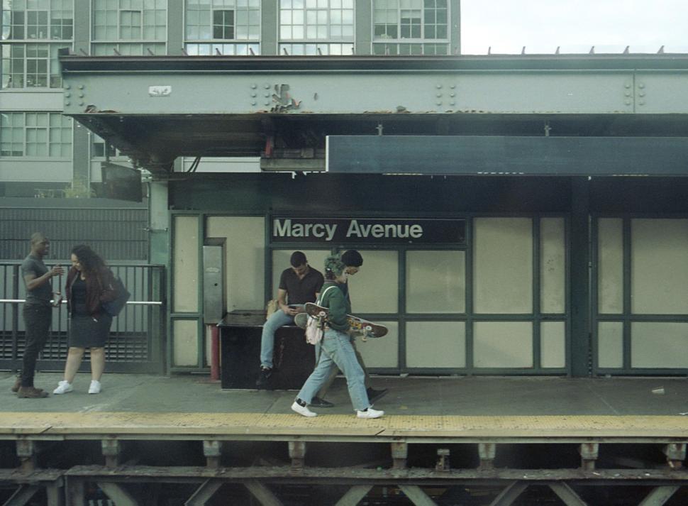 Free Image of People waiting and walking at Marcy Avenue subway station in Brooklyn 