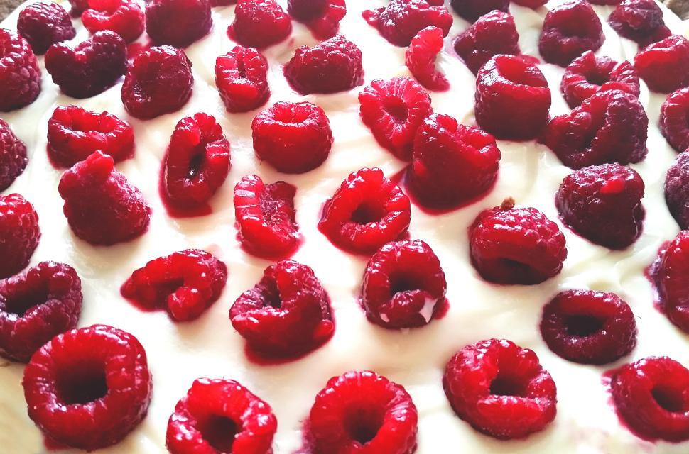 Free Image of Delicious raspberry dessert topped with fresh berries 
