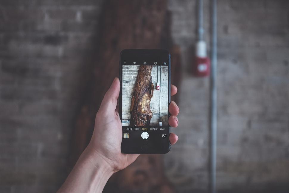 Free Image of Capturing unique textures with a smartphone in urban setting 