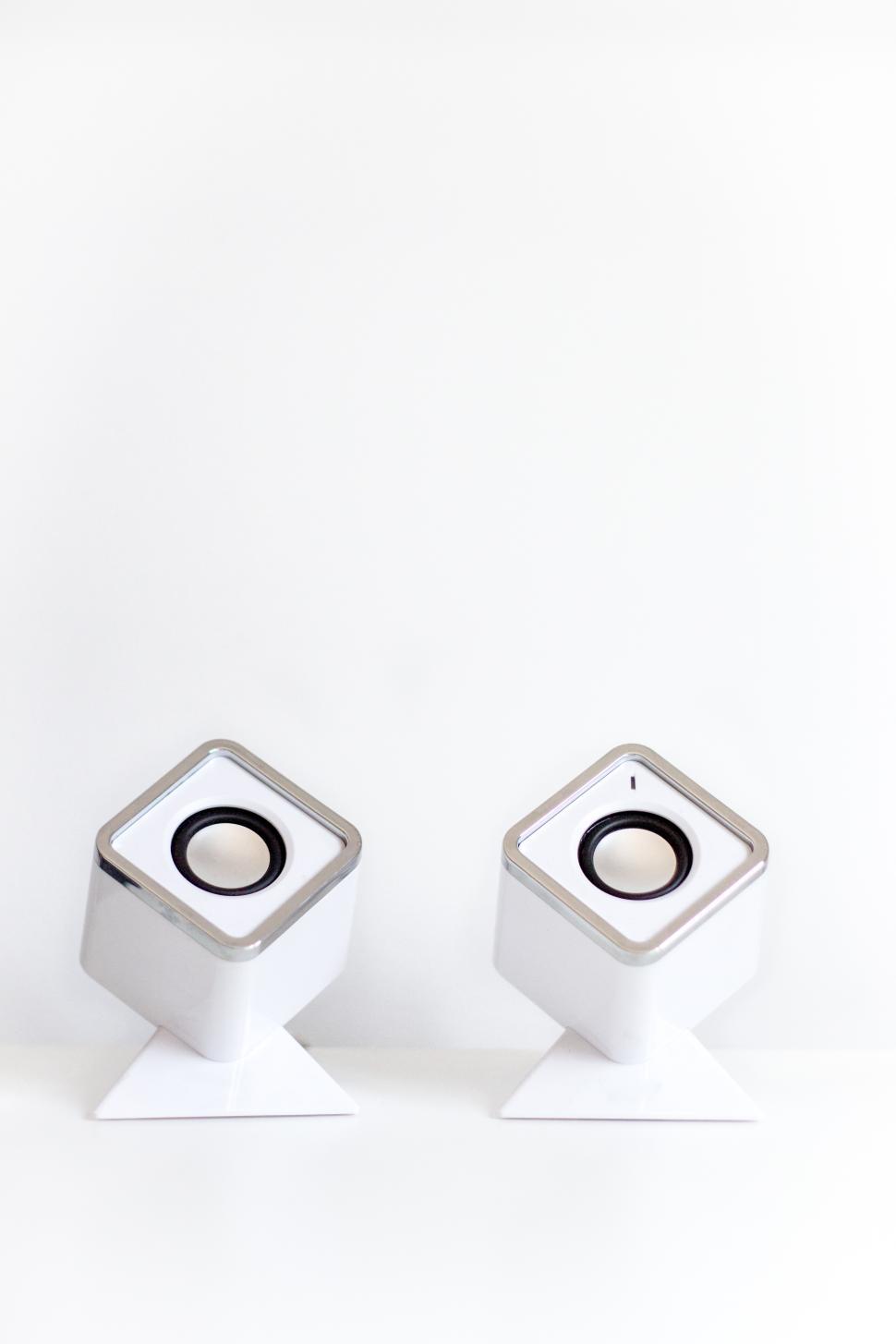 Free Image of Unique white speakers on minimalist background 