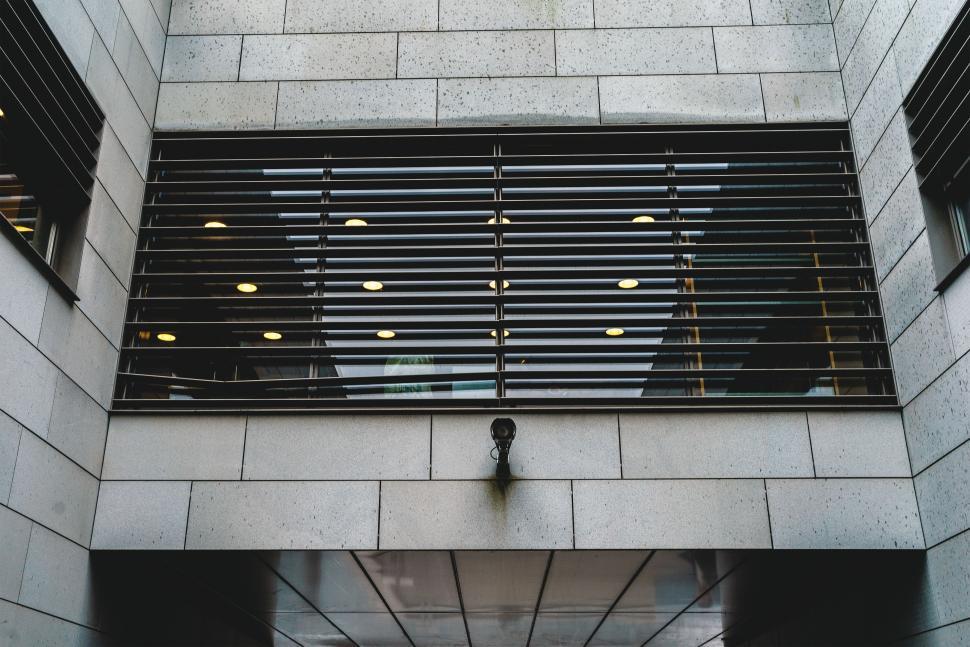 Free Image of Modern building with distinctive window design and security 