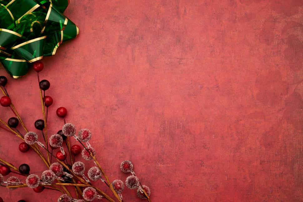 Free Image of Holiday decorations with red background and gift bow 