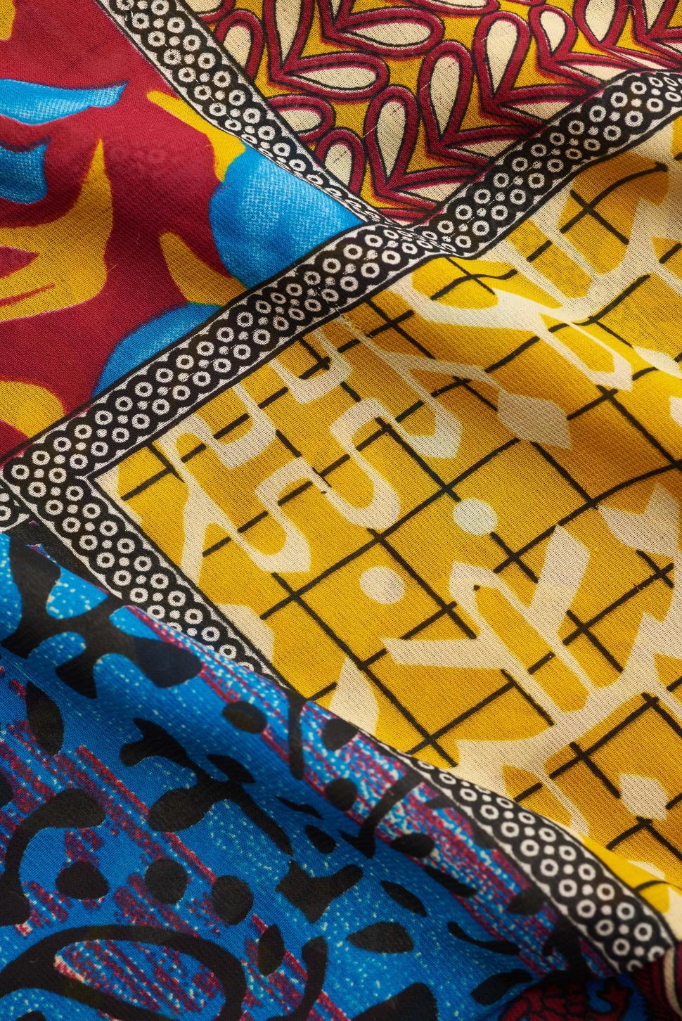 Free Image of Brightly colored fabric displays a mix of intricate patterns 