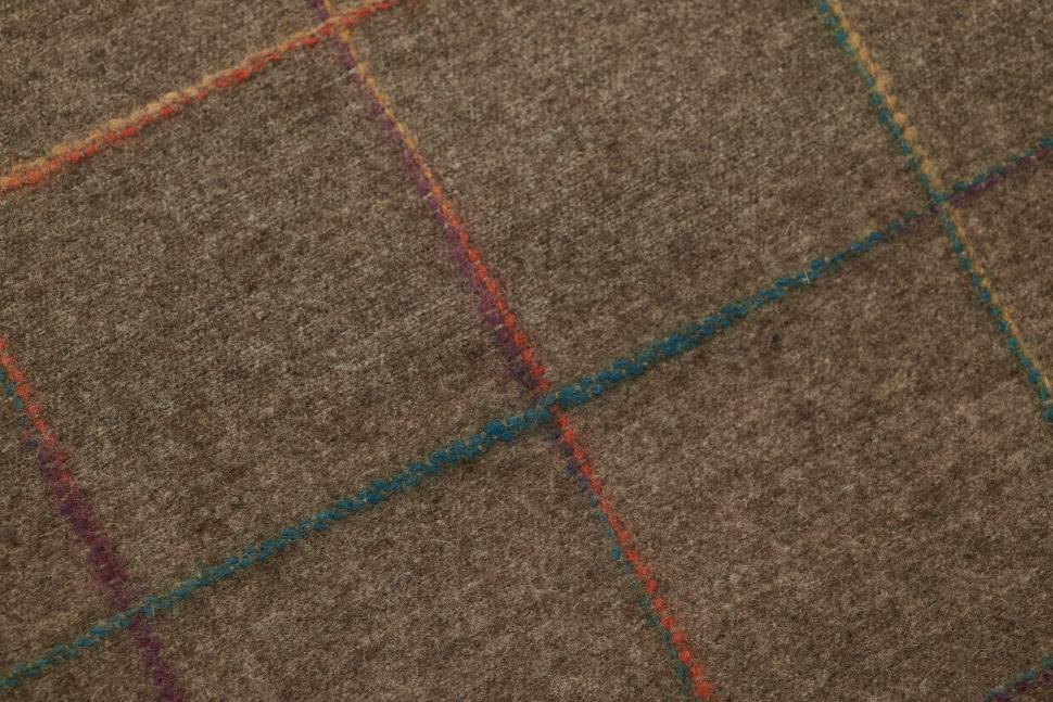 Free Image of Brown wool fabric with colorful plaid pattern used for upholstery or apparel 