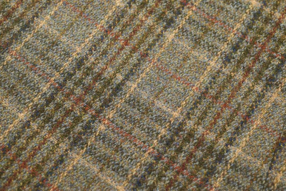 Free Image of Textile pattern showcasing a plaid design with earthy tones for fashion use 