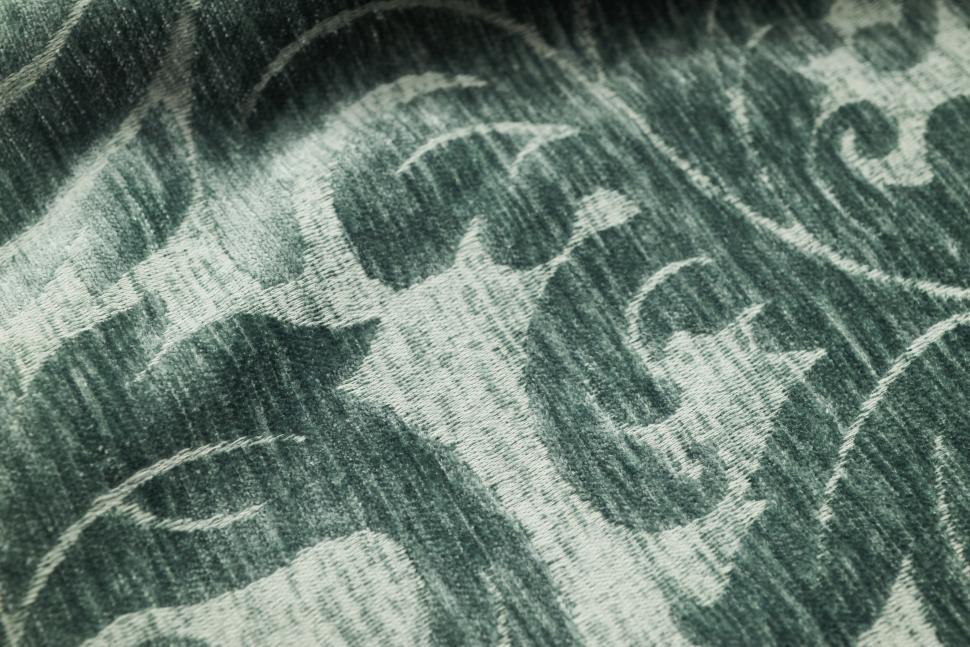 Free Image of Elegant patterned fabric with intricate design details in green tones 