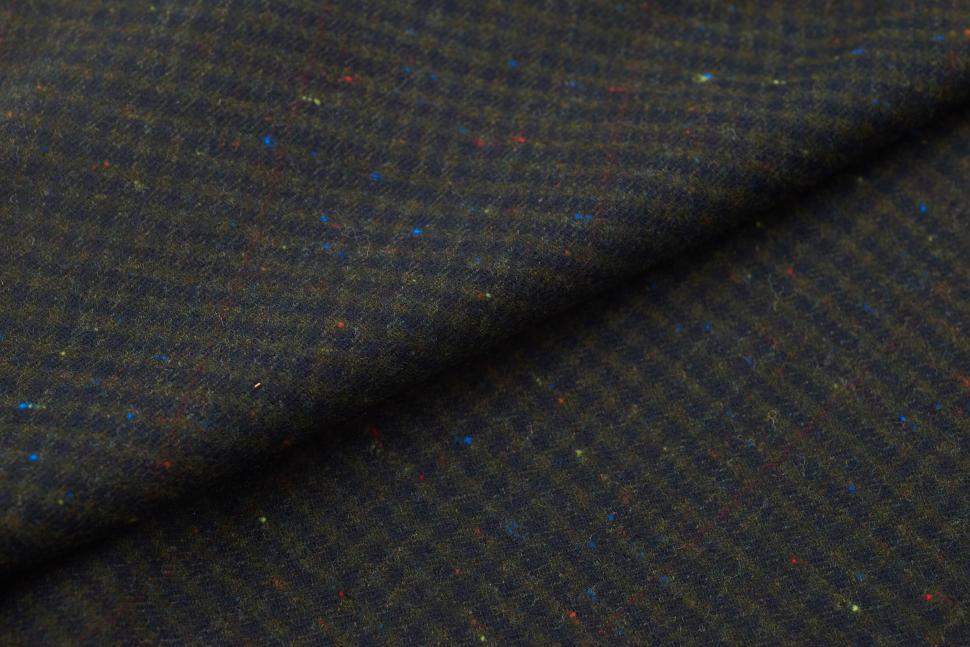 Free Image of Elegant black fabric with colorful flecks displayed in woven texture 