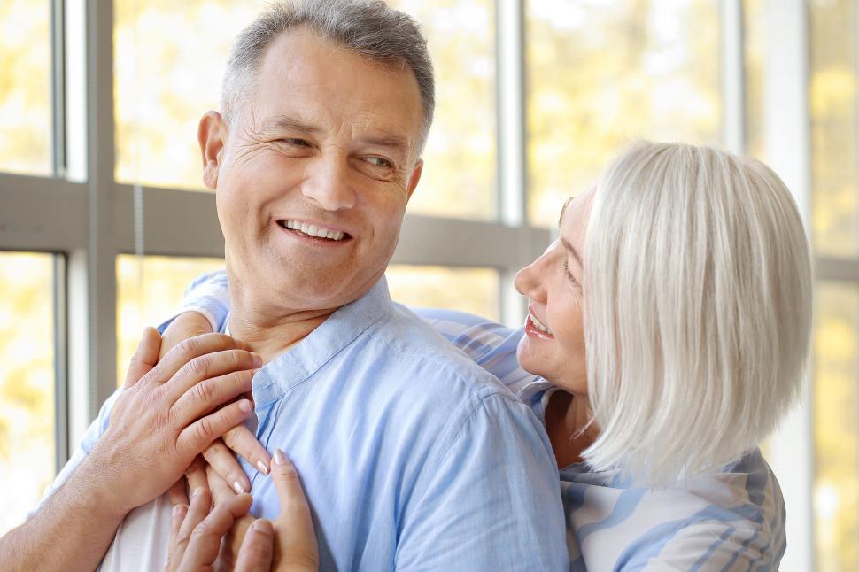 Free Image of Couple sharing joyful moment indoors during autumn season 