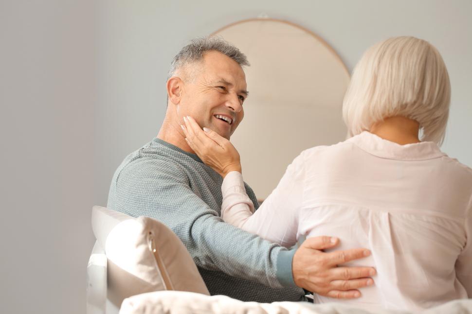 Free Image of Couple sharing a tender moment in a cozy living room 