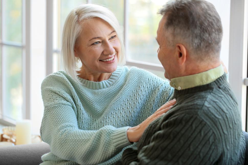 Free Image of Couple enjoying a cozy moment indoors during daylight hours 