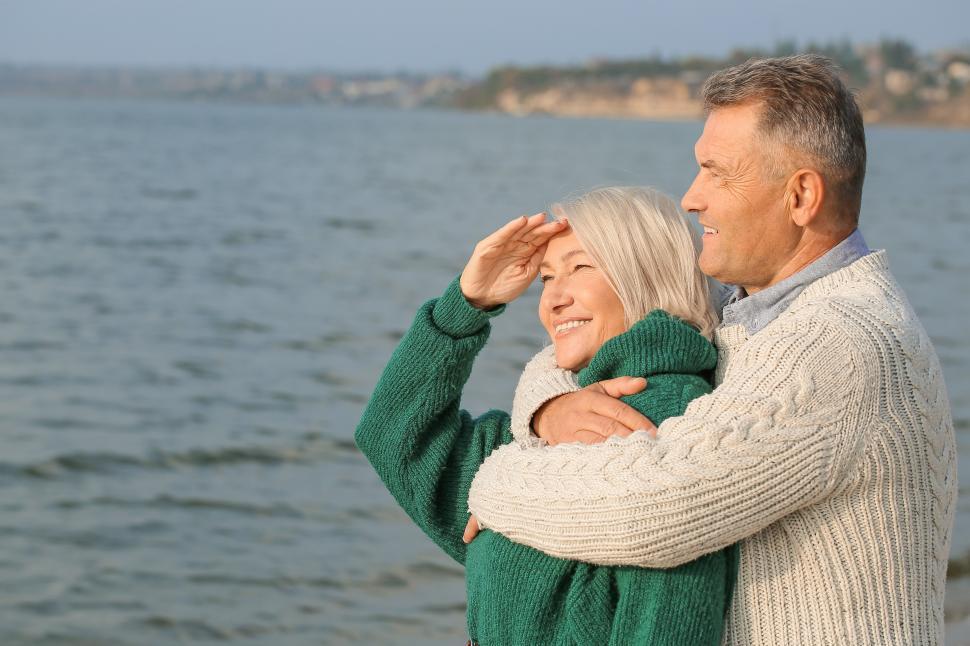 Free Image of Couple enjoying a peaceful moment by the water 