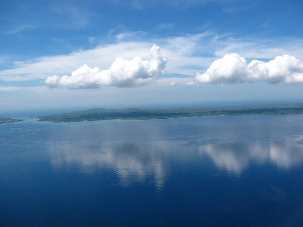 Free Image of Vast Water Body Surrounded by Clouds 