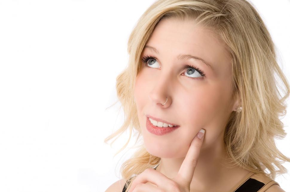 Free Image of Young Woman Looks Up 