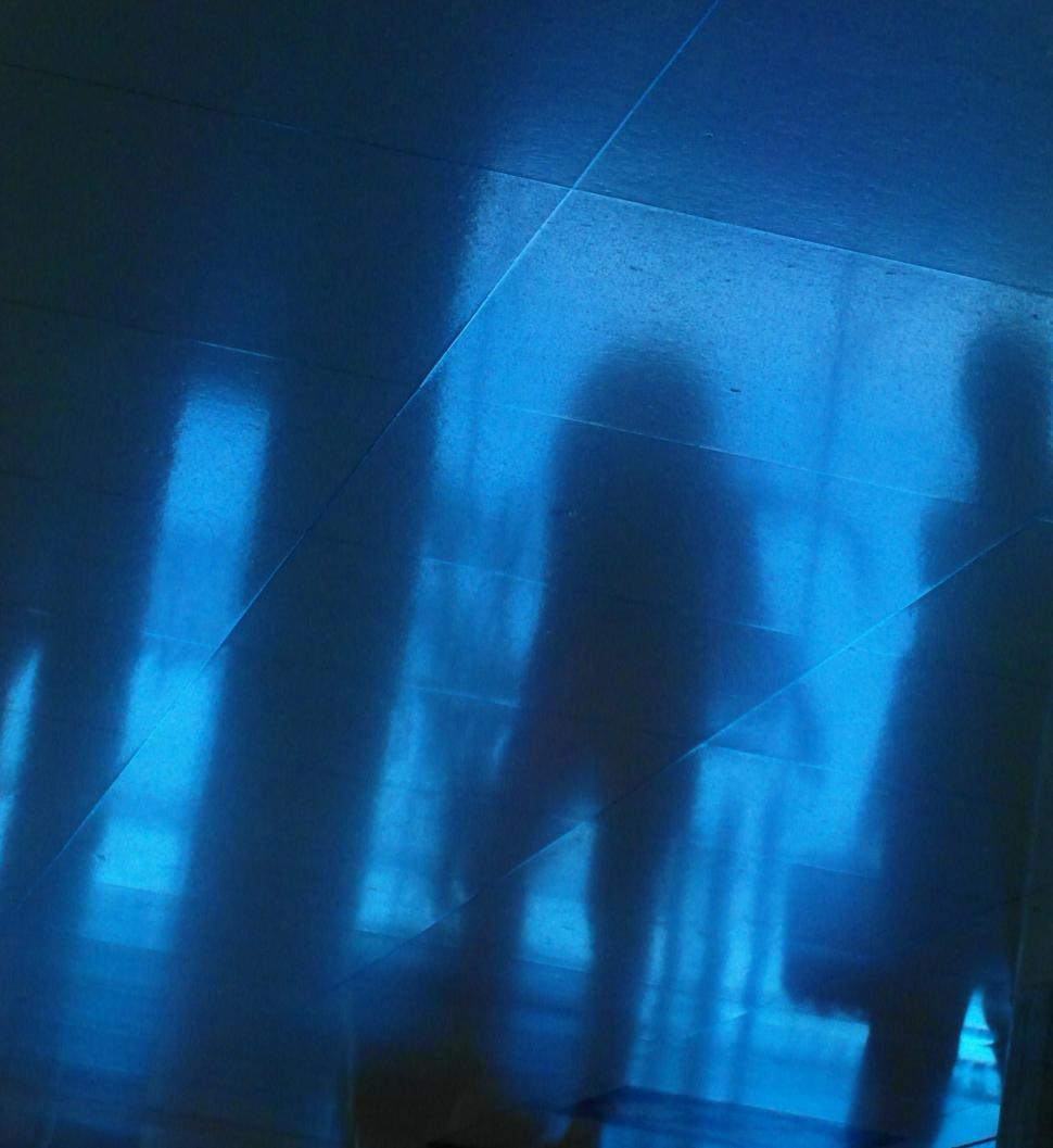 Free Image of Reflection of people walking 