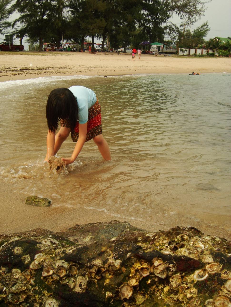 Free Image of Girl Playing on the Beach 