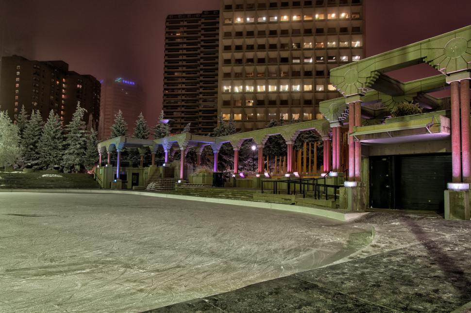 Free Image of Snow Covered Field With Building in Background 