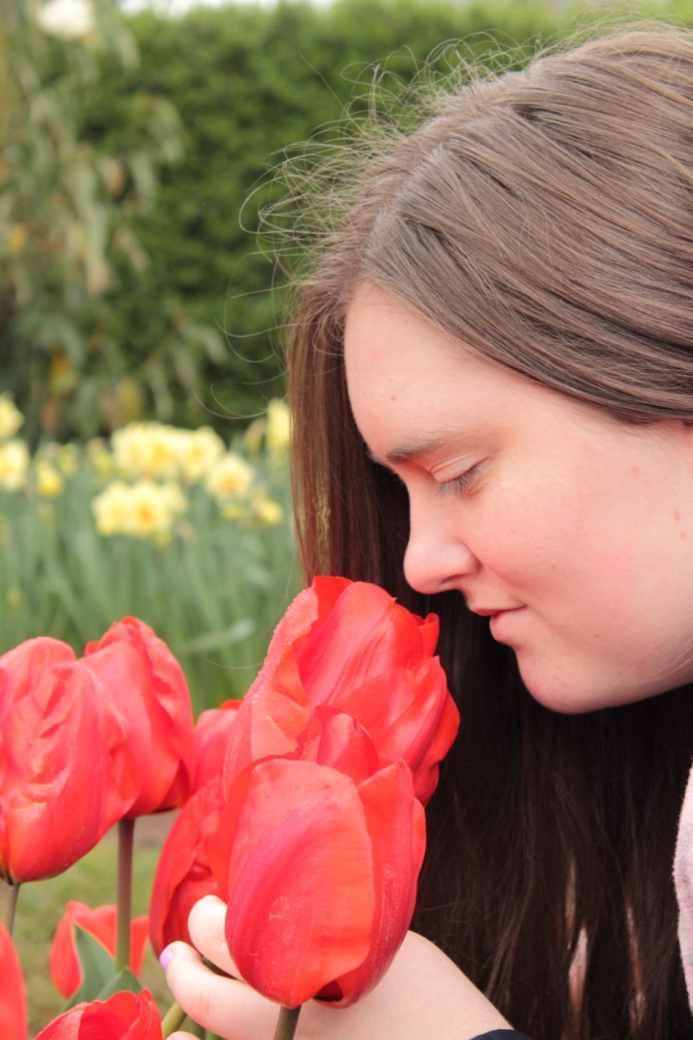 Free Image of Smelling the tulips 