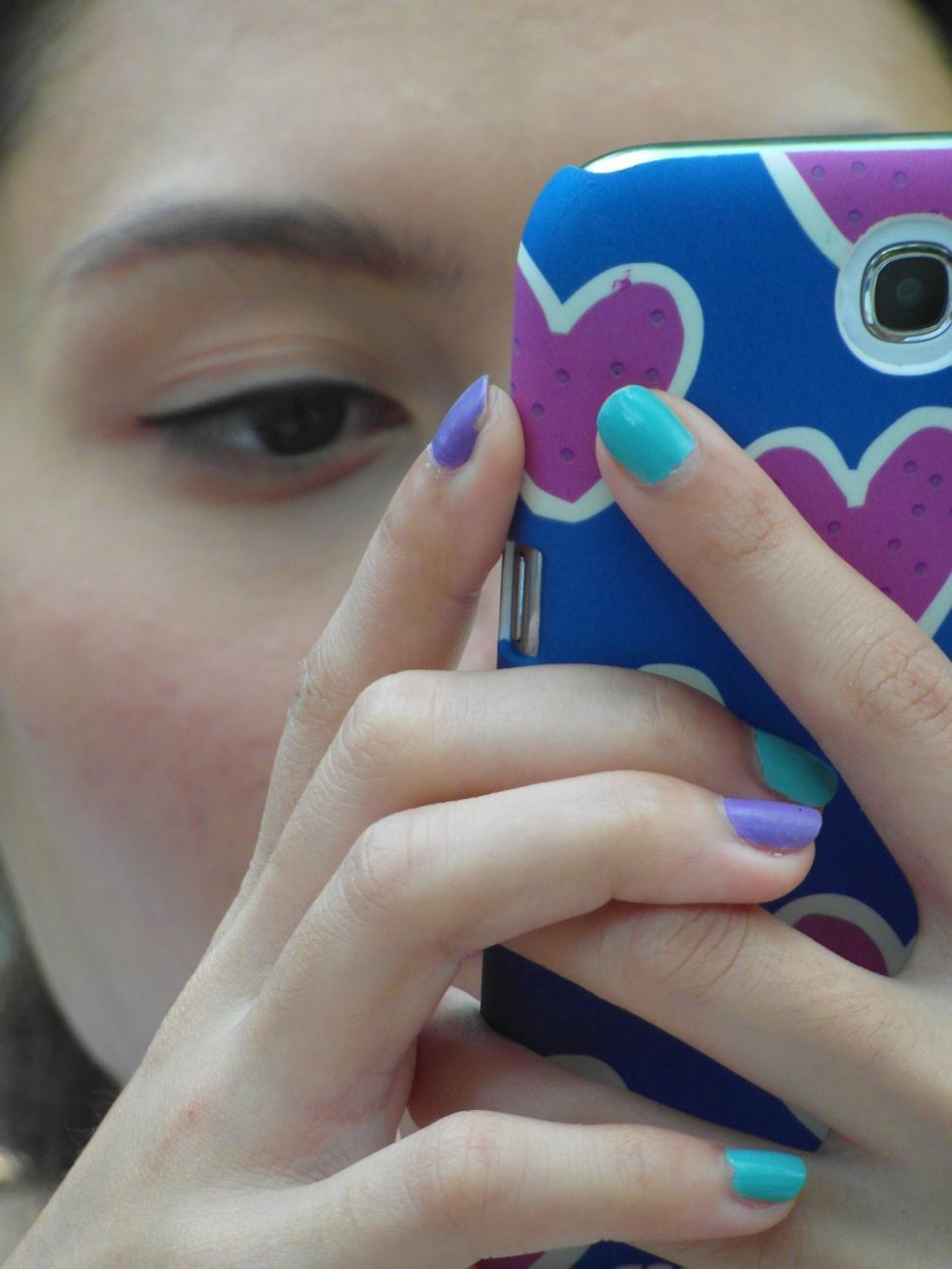 Free Image of Girl Using Touch Screen Phone 