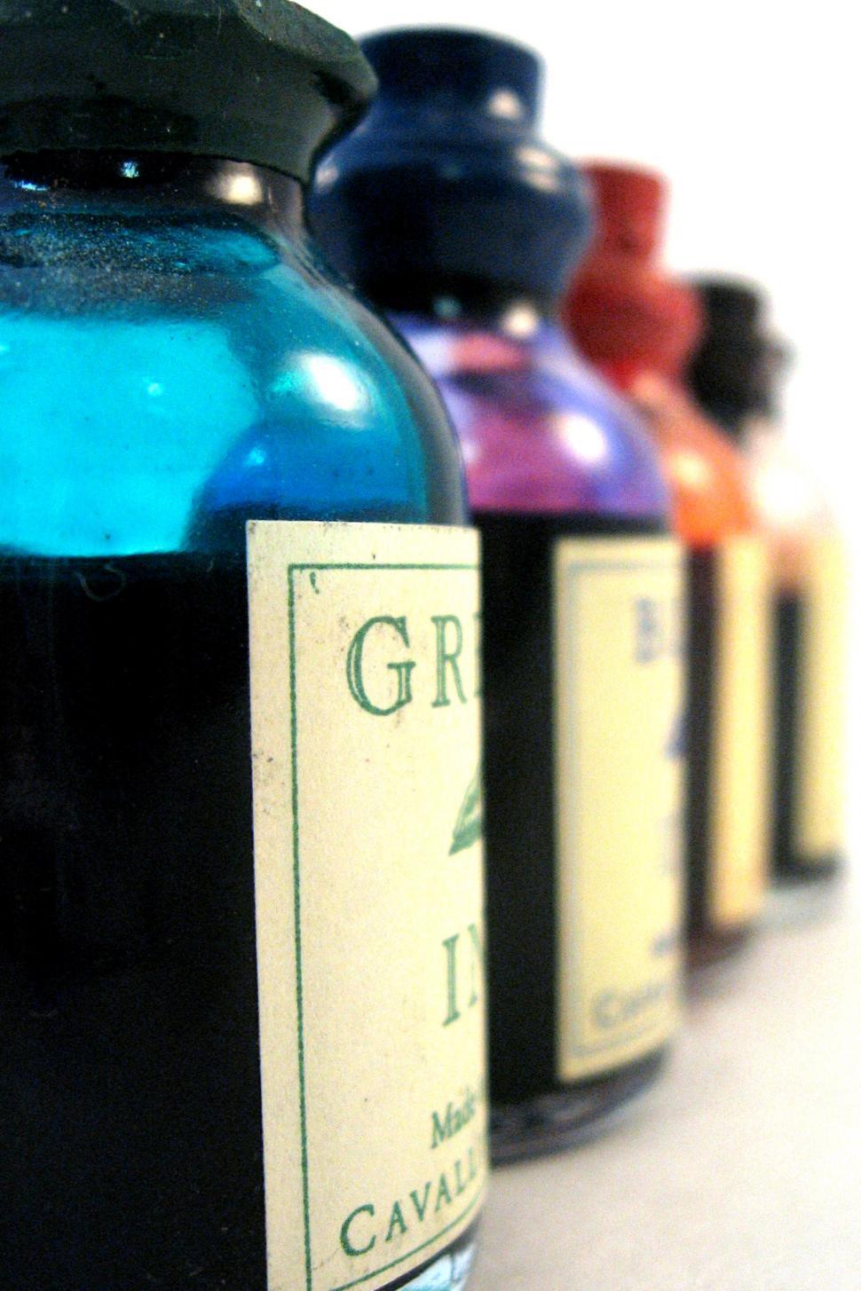 Free Image of Row of Bottles With Labels 