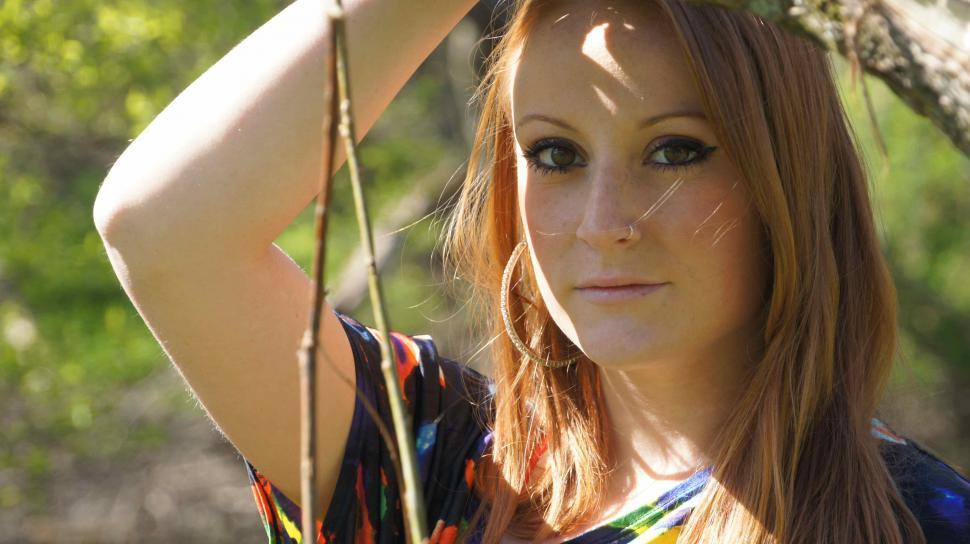 Free Image of Red Head Posing By Branch 