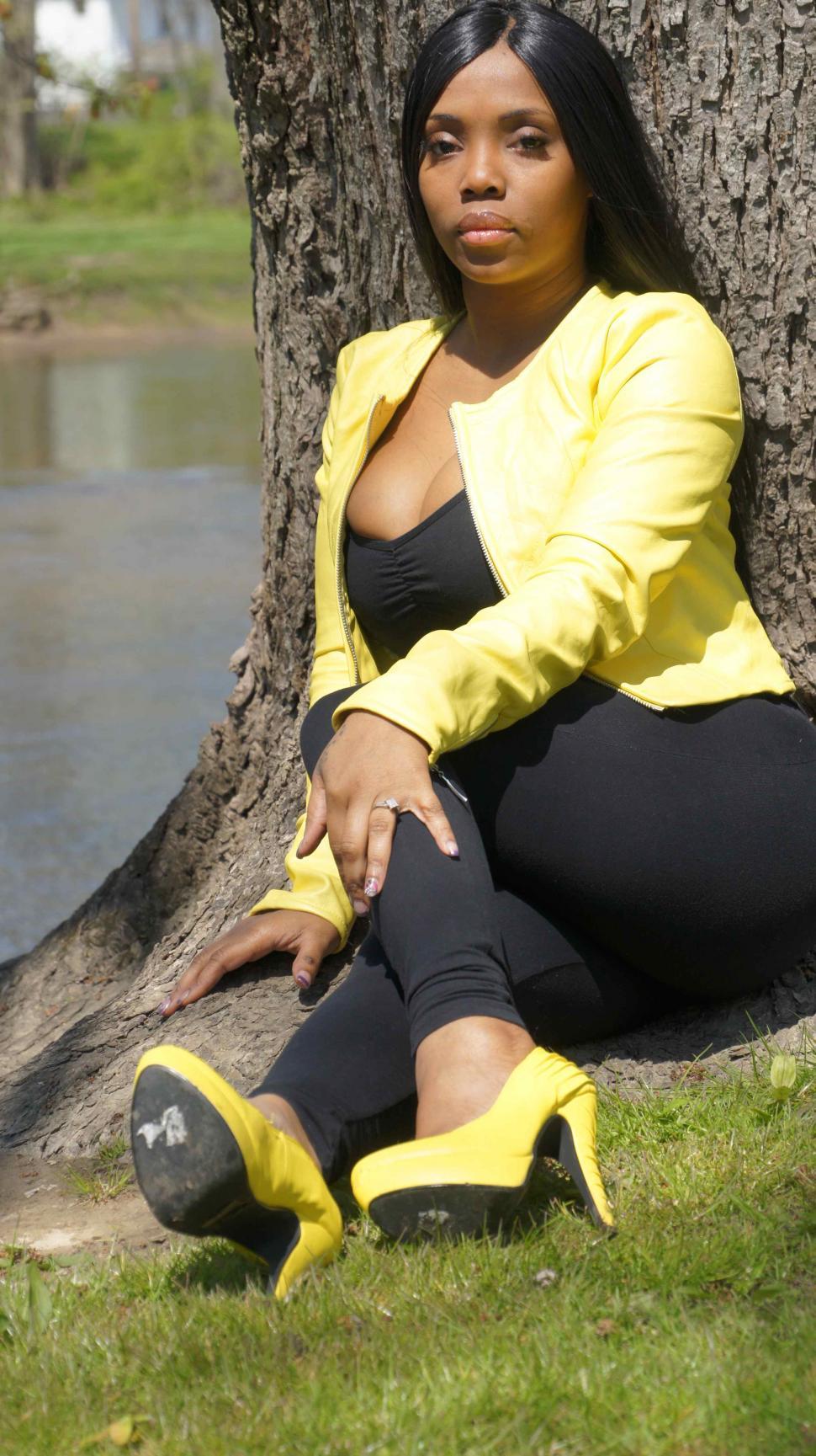 Free Image of Women Sitting by the River 