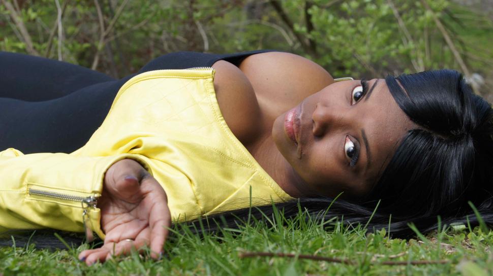 Free Image of Woman Poses with Tree 