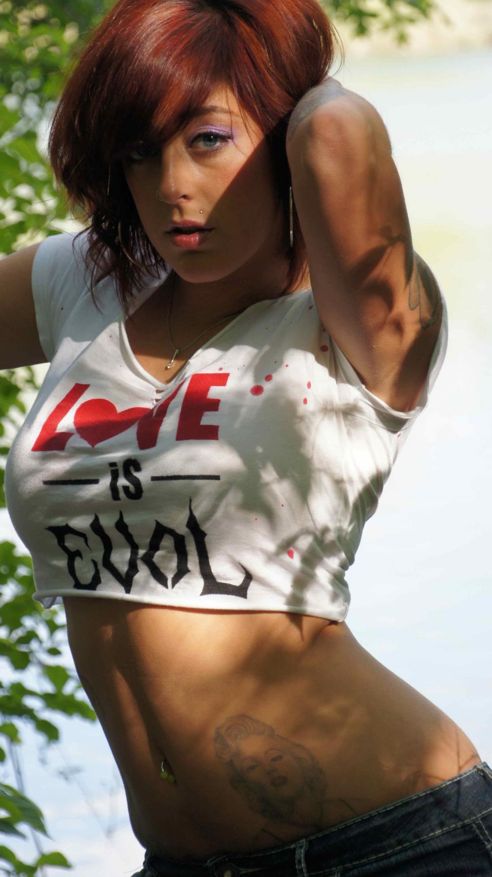 Free Image of Woman Poses by Lake 