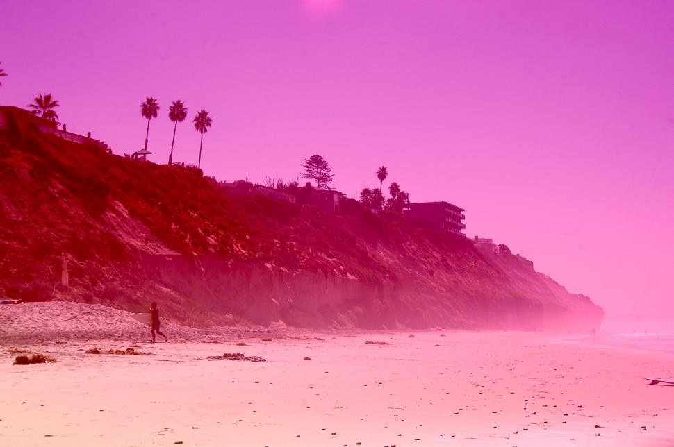 Free Image of Pink Sky Beach and the Ocean 