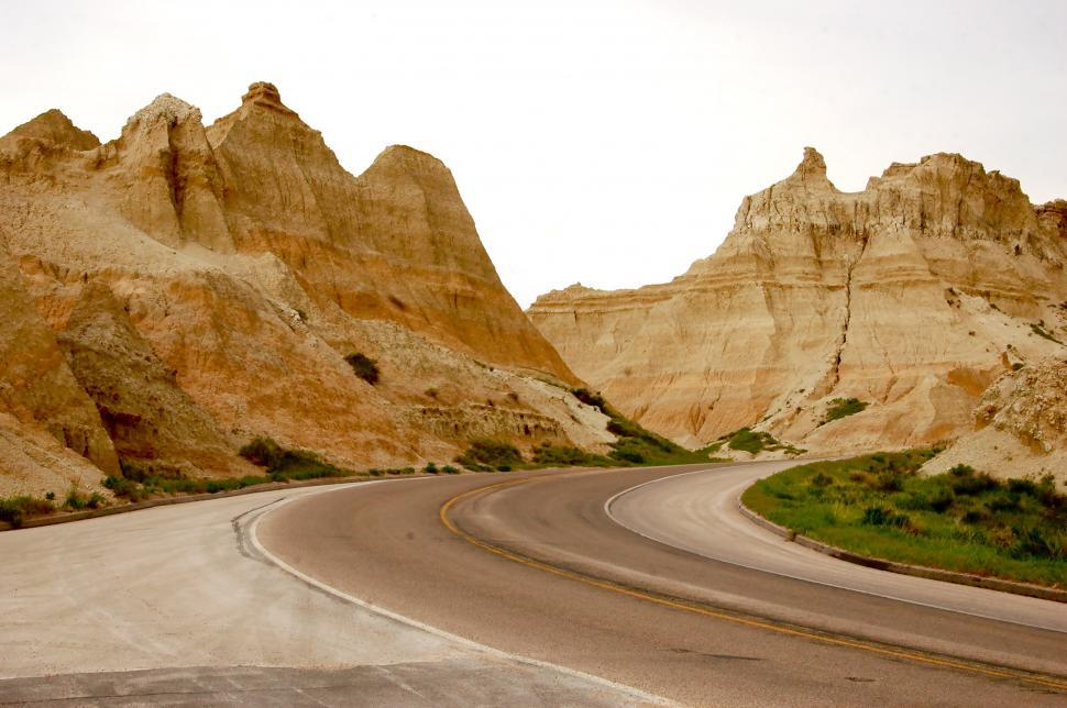 Free Image of Winding Desert Road through Badlands 
