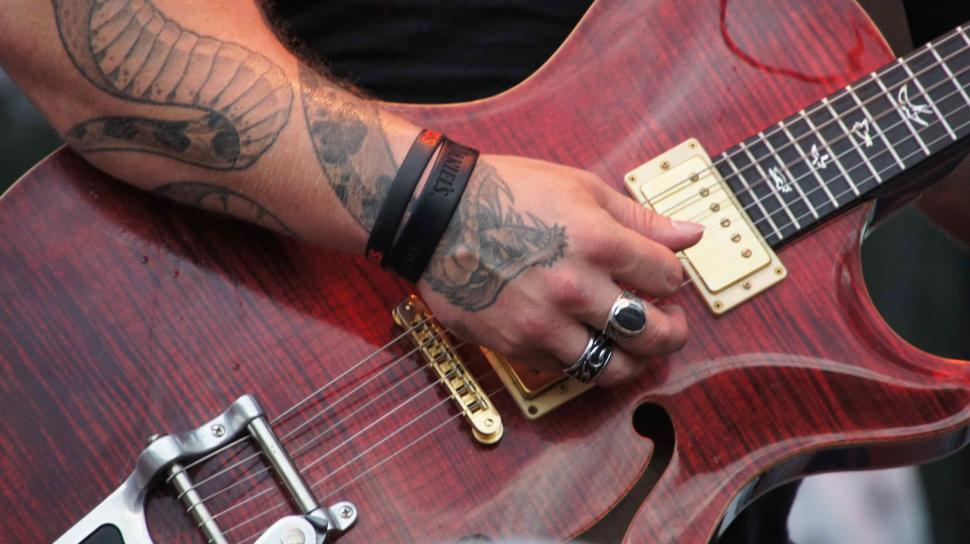 Free Image of Guitar and Mixing Board 
