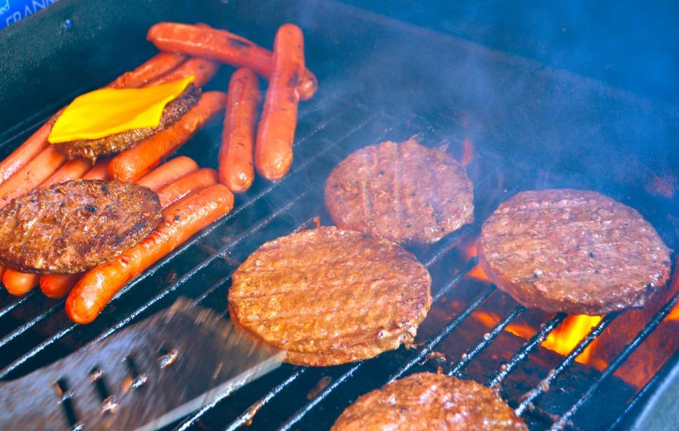 Free Image of BBQ Grill with Hamburgers and Hot Dogs 