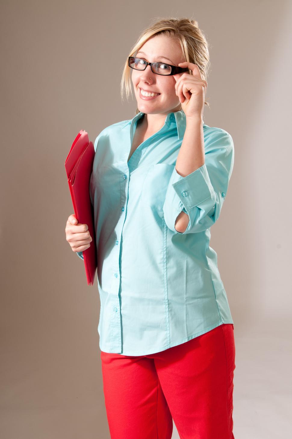 Free Image of Young woman with files 