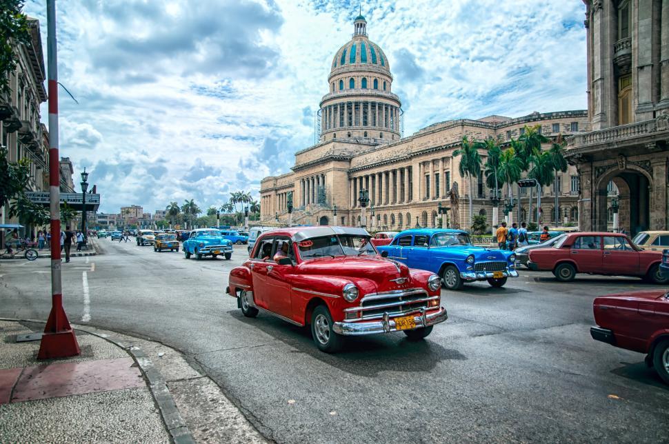 Free Image of El Capitolio and a red car 