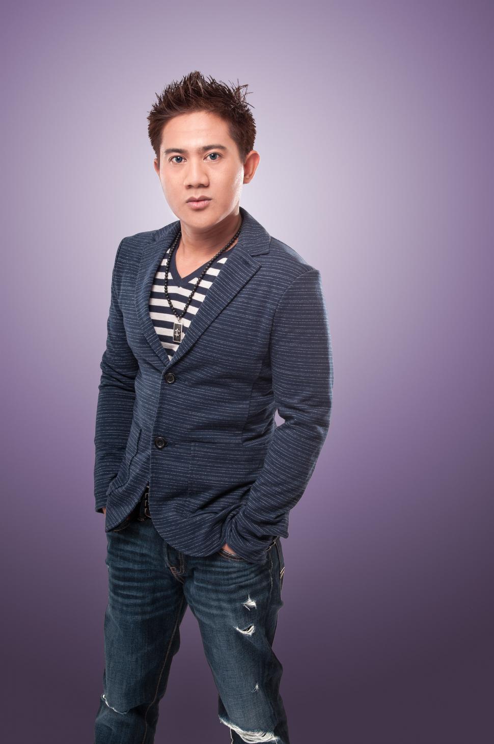 Free Image of Stylish young Asian man looking at camera 