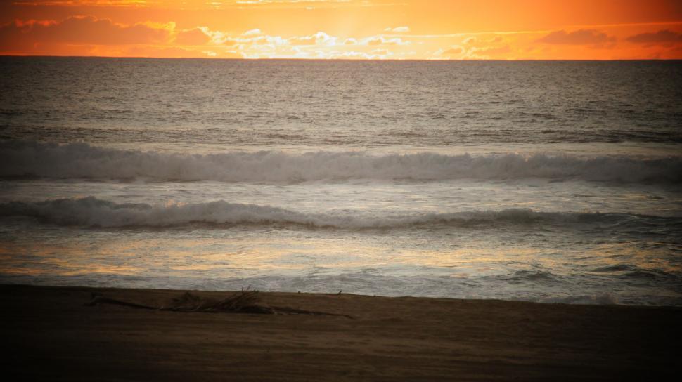 Free Image of Waves in the sunset.  