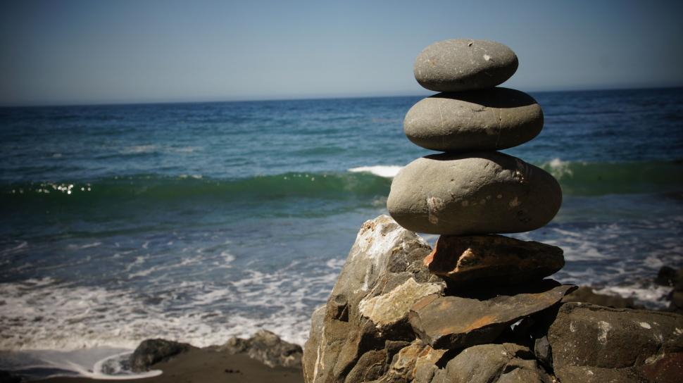 Free Image of Rock Stacking by the Ocean 