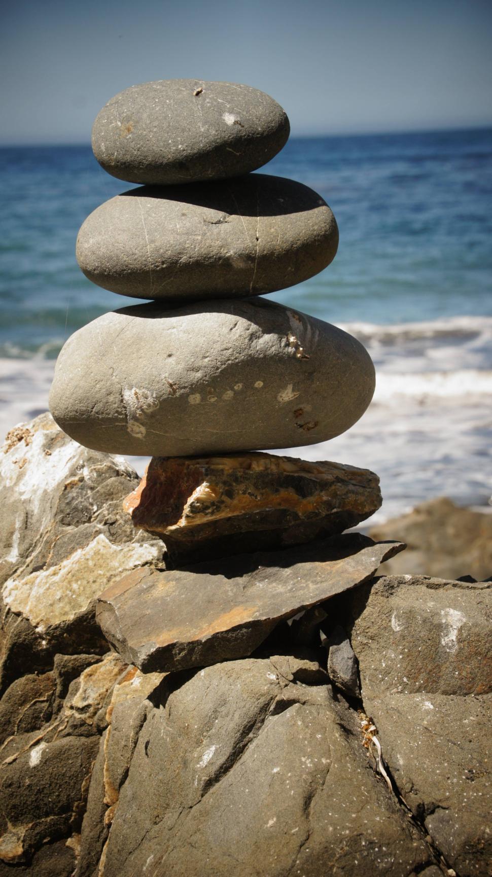Free Image of Rock Stacking by the Ocean 