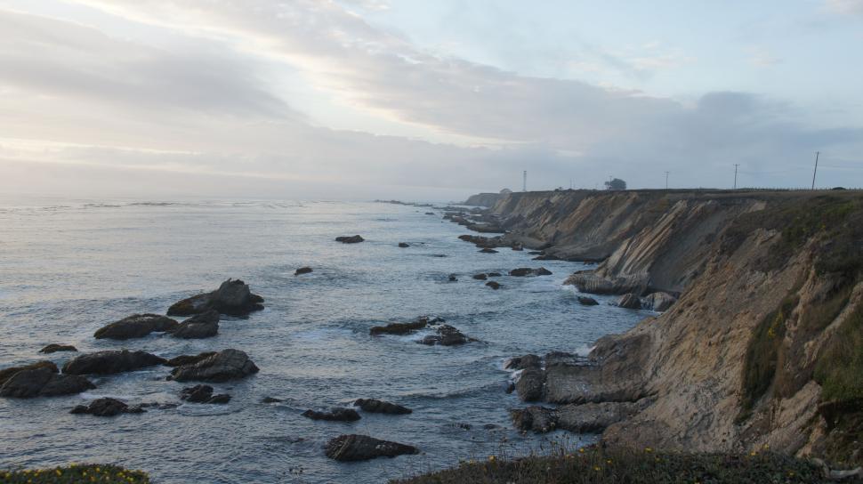 Free Image of Rocky Shoreline at Sunset 