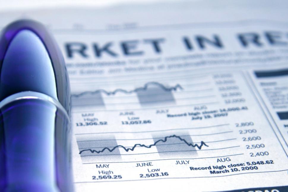 Free Image of Stock Report with Big, Blue Pen 
