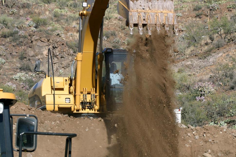 Free Image of Dumping scoop of dirt 