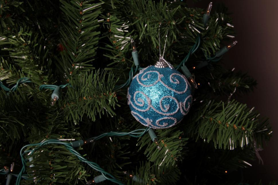 Free Image of Blue Christmas ornament on a tree 
