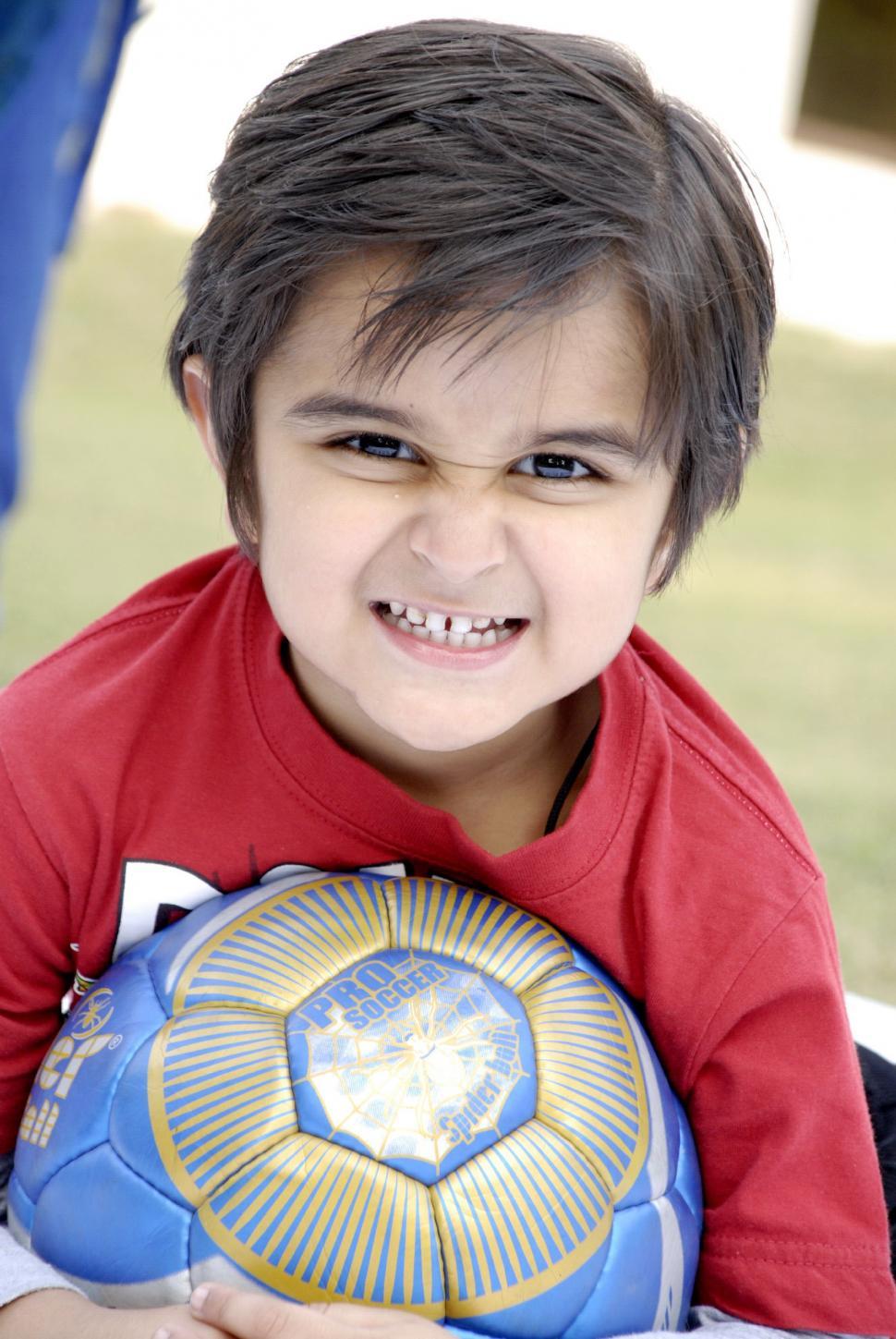 Free Image of Cute Child with Football 