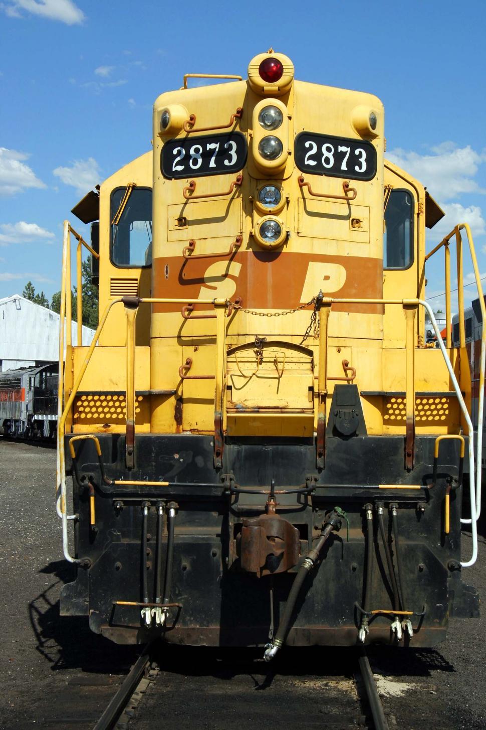 Free Image of Large Yellow Train on Steel Track 